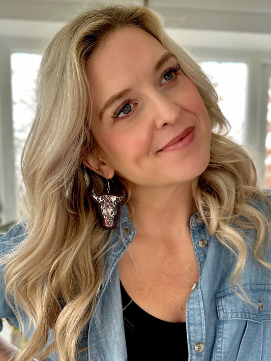 "Wooden cow head earrings with bold Aztec print design and minimalist version, perfect for boho and rustic style lovers."