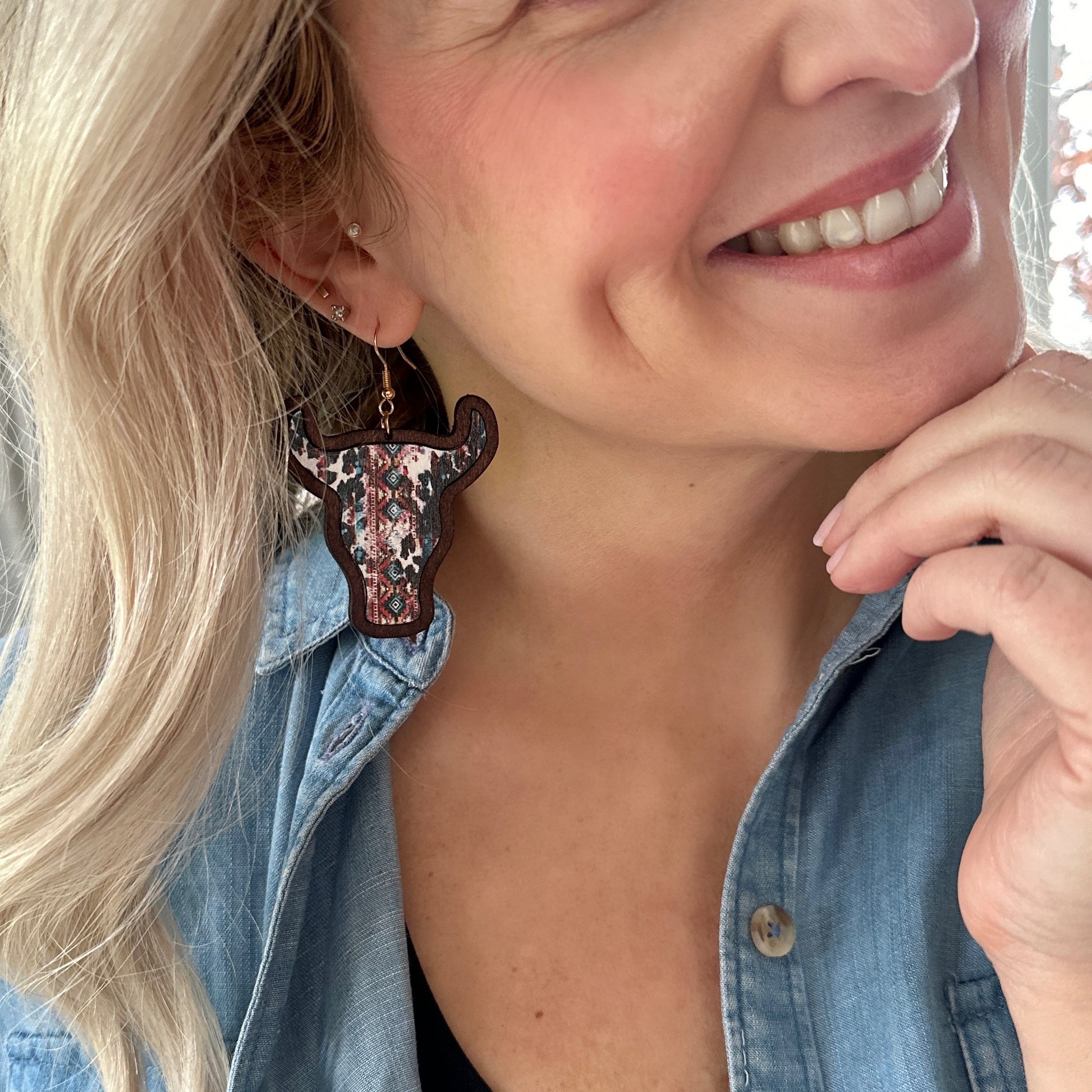 "Wooden cow head earrings with bold Aztec print design and minimalist version, perfect for boho and rustic style lovers."